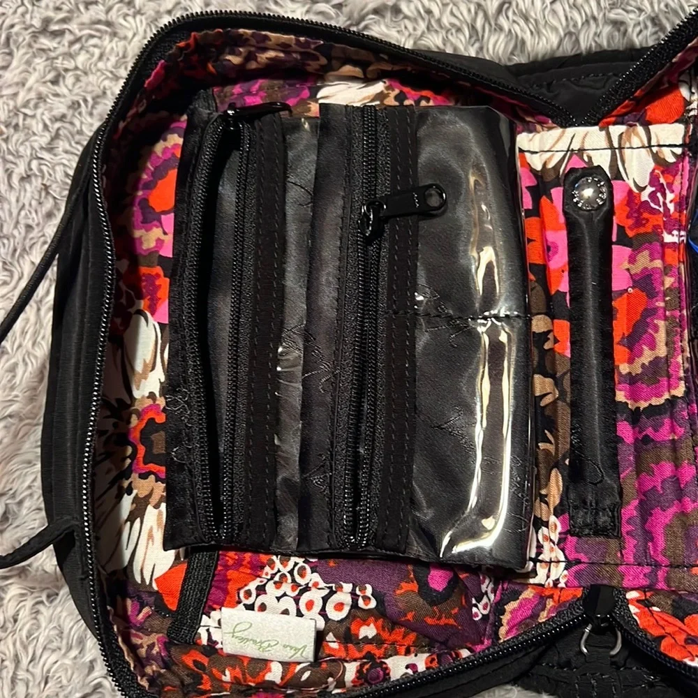 Vera Bradley black toiletry bag with 4 zippered pockets inside. Great condition!